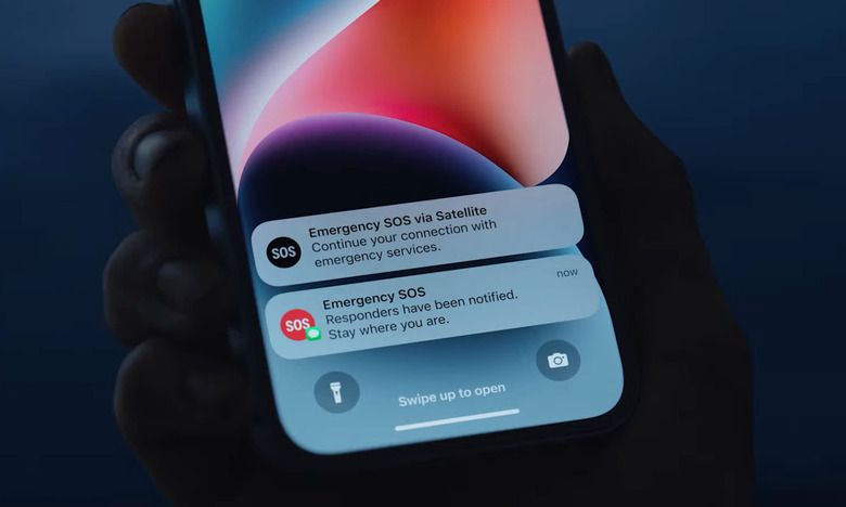 Screenshot from the iPhone 14 event. A closeup of an iPhone with two notifications regarding Emergency SOS via satellite.