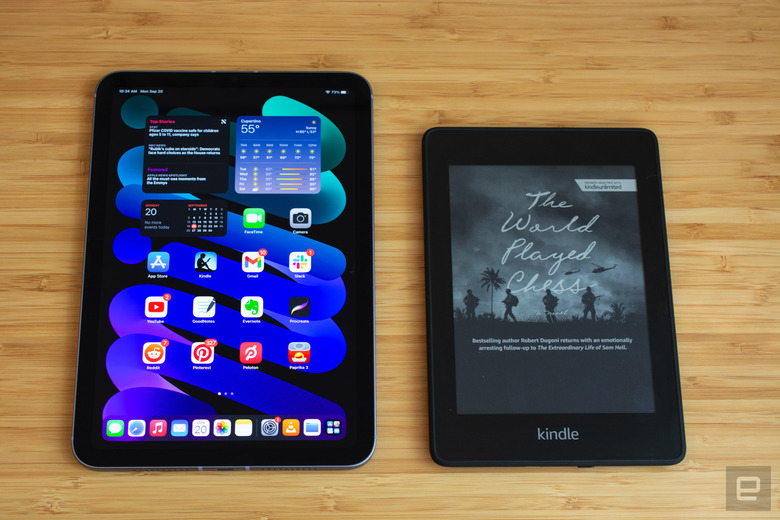 The 2021 iPad mini next to Amazon's Kindle Paperwhite.