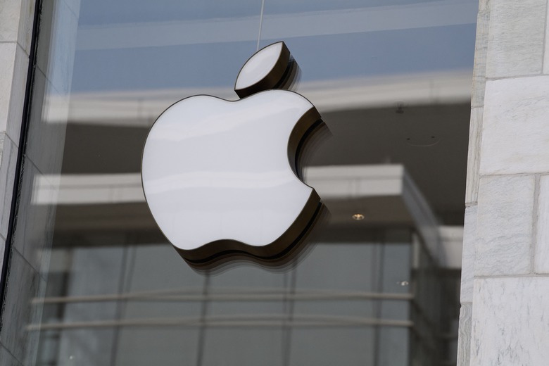 The Apple logo is seen at the entrance of an Apple store in Washington, DC, on September 14, 2021. - Apple users were urged on Tuesday to update their devices after the tech giant announced a fix for a major software flaw that allows the Pegasus spyware to be installed on phones without so much as a click. (Photo by Nicholas Kamm / AFP) (Photo by NICHOLAS KAMM/AFP via Getty Images)