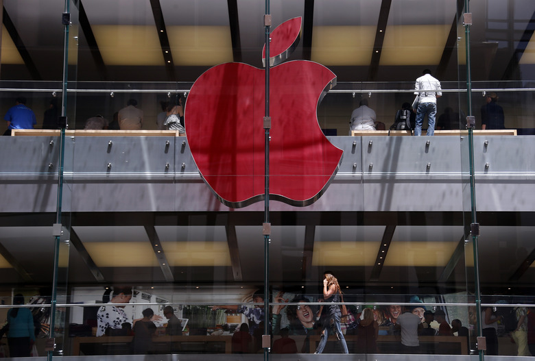 The Apple logo on display at the Sydney Apple Store is illuminated in red to mark World AIDS Day, in Sydney December 1, 2014. Apple stores across the world will display similar colored logos, with the Sydney store being the first. World AIDS Day is observed annually on December 1, which helps to raise awareness about AIDS and the spread of HIV.      REUTERS/David Gray      (AUSTRALIA - Tags: SOCIETY BUSINESS LOGO TPX IMAGES OF THE DAY)