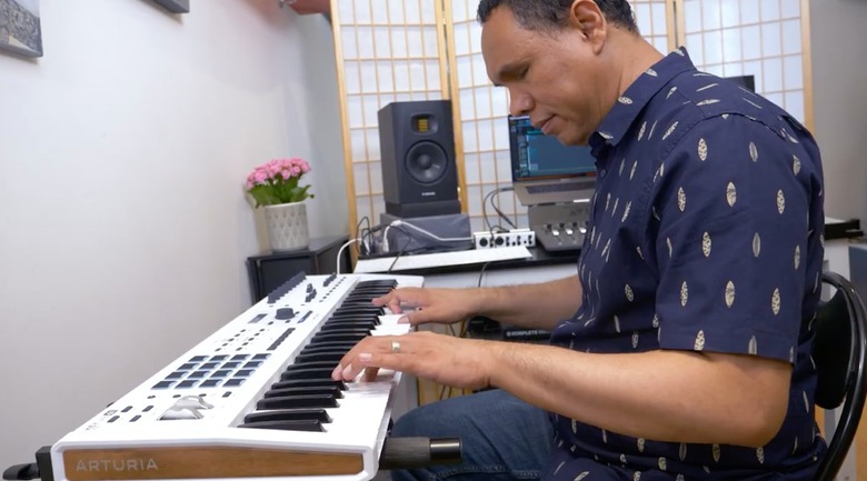 Music producer Jason Dasent playing on an Arturia keyboard