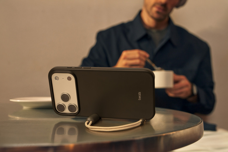 An iPhone inside a case on a table.
