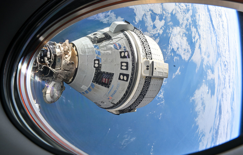 A spacecraft with a view of Earth in the background.