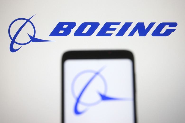 UKRAINE - 2021/03/07: In this photo illustration a Boeing logo is seen on a smartphone and a pc screen. (Photo Illustration by Pavlo Gonchar/SOPA Images/LightRocket via Getty Images)