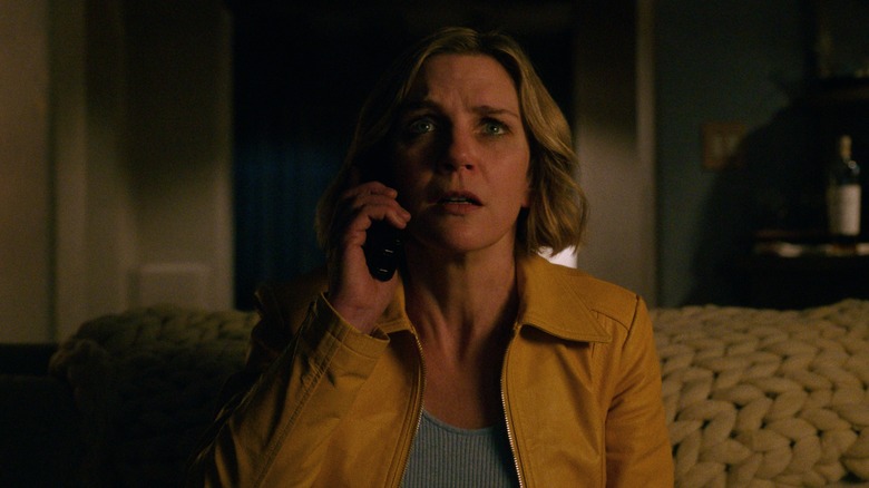 A still of Rhea Seehorn's character from Pluribus receiving what seems like a surprising phone call.