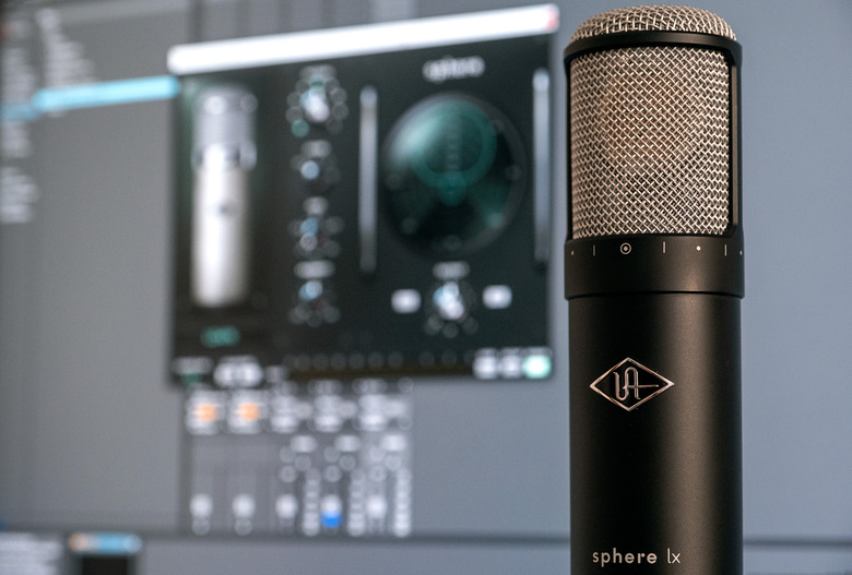 Universal Audio's Sphere LX modeling microphone is pictured infront of a PC monitor.