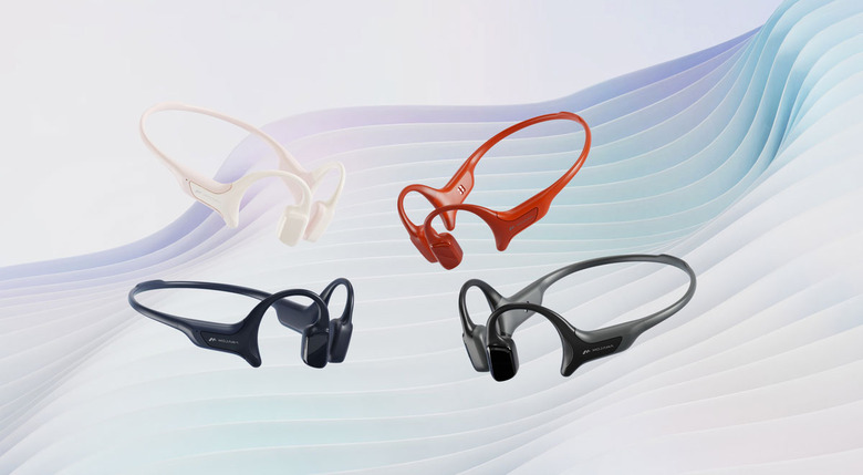 Image of four versions of the HaptiFit Terra in a variety of colors on a background where white and purple lines are ululating.