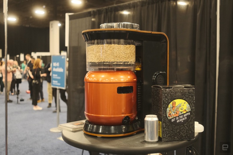 An Exobrew sitting on a messy table at CES Unveiled 2024 next to Get to the Hoppa beer.