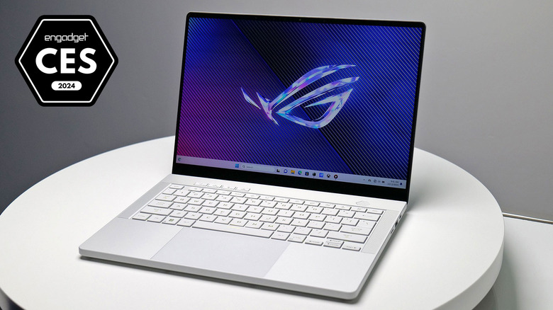 An image with a badge for Engadget Best of CES 2024 showing the product: ASUS ROG Zephyrus G14 laptop on a white table display at the event. 