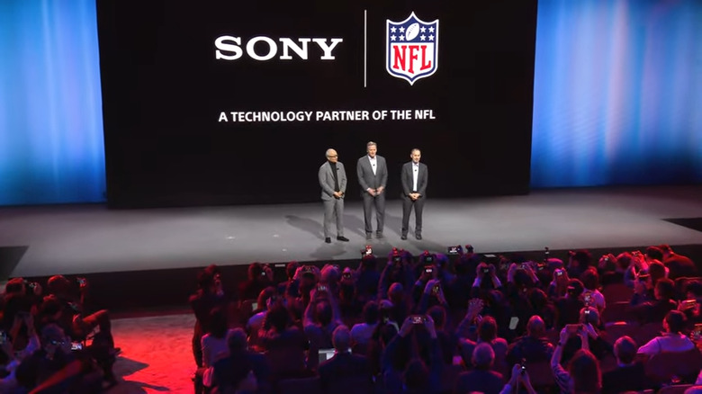 NFL Commissioner Roger Goodell joins the Sony execs on the stage.