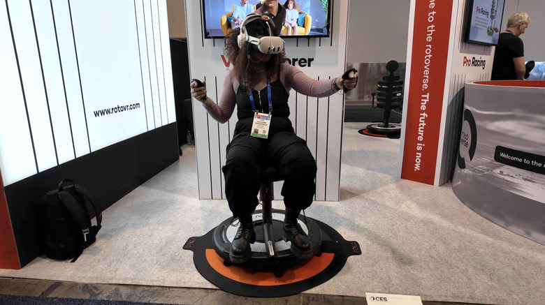 Engadget editor Cheyenne MacDonald sits in the Roto VR explorer chair using a Meta Quest 3 headset