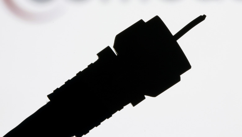 FILE - This July 30, 2008 file photo shows a silhouetted coaxial cable in Philadelphia. Cord cutters rejoiced last week after HBO and CBS announced plans to sell stand-alone streaming services, a move that cable and satellite television providers have resisted for years. But cutting the cord won’t mean cutting out your cable provider, and some would-be customers may balk when they see just how much paying a la carte actually costs. (AP Photo/Matt Rourke, File)