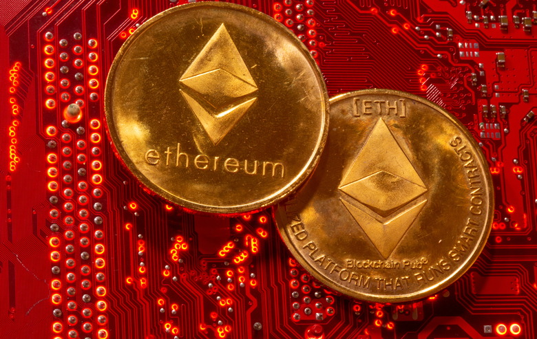 Representations of cryptocurrency Ethereum are placed on PC motherboard in this illustration taken, June 29, 2021. REUTERS/Dado Ruvic/Illustration