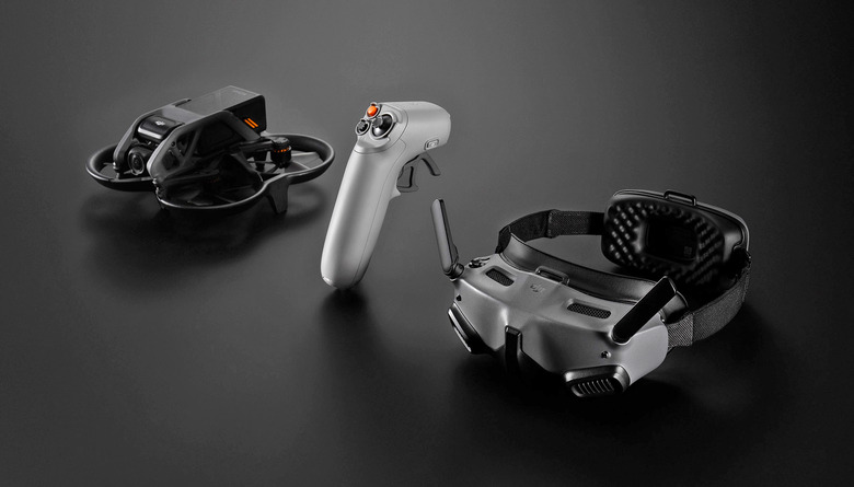 A DJI Avata drone, Goggles Integra and RC Motion 2 handheld controller sit on a flat black table.
