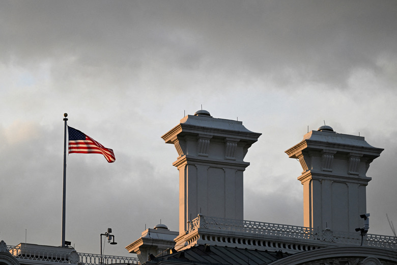 An American flag on the Eisenhower Executive Office Building waves in the wind in Washington, D.C., U.S., November 6, 2024. REUTERS/Annabelle Gordon