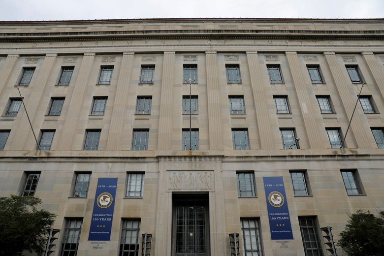 Signage is seen at the headquarters of the United States Department of Justice (DOJ) in Washington, D.C., U.S., May 10, 2021. REUTERS/Andrew Kelly