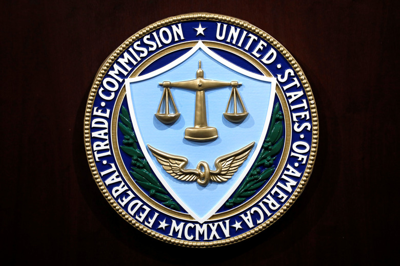 FILE PHOTO: Federal Trade Commission seal is seen at a news conference at FTC Headquarters in Washington, U.S., July 24, 2019. REUTERS/Yuri Gripas/File Photo