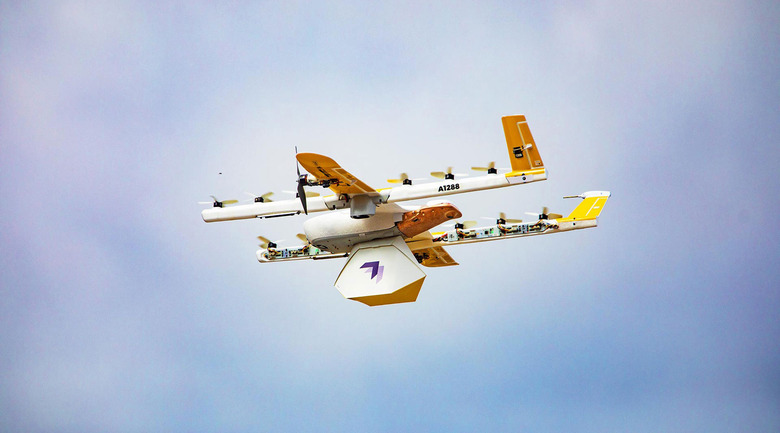 A Wing delivery drone mid-flight.