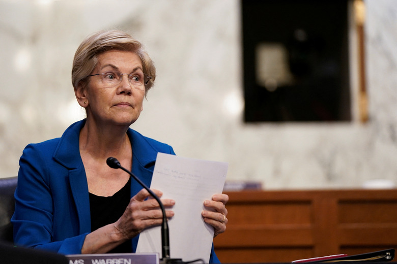 U.S. Senator Elizabeth Warren (D-MA) looks on as Federal Reserve Chair Jerome Powell testifies before a Senate Banking, Housing, and Urban Affairs Committee hearing on the 