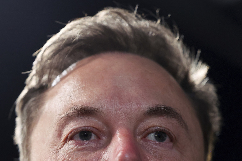 Tesla and SpaceX's CEO Elon Musk attends the AI Safety Summit at Bletchley Park, on Wednesday, Nov. 1, 2023 in Bletchley, England. Digital officials, tech company bosses and researchers are converging Wednesday at a former codebreaking spy base near London to discuss and better understand the extreme risks posed by cutting-edge artificial intelligence. (Toby Melville/Pool Photo via AP)