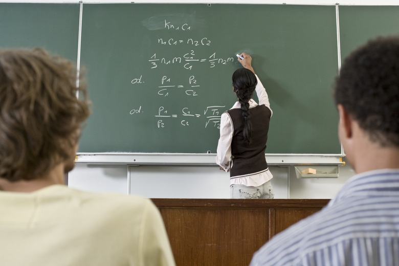 Student Using Blackboard in Classroom