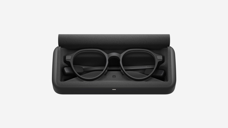A pair of Even G2 Display Smart Glasses in a charging case.
