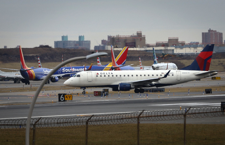 Commercial airplanes are pictured backed up waiting to depart on the runway after flights earlier were grounded during an FAA system outage at Laguardia Airport in New York City, New York, U.S., January 11, 2023. REUTERS/Mike Segar