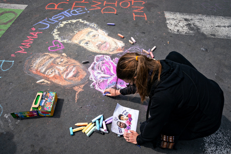 MINNEAPOLIS, MN - APRIL 18: People gather in George Floyd Square for an AAPI and Black solidarity rally on Sunday, April 18, 2021 in Minneapolis, MN. (Jason Armond / Los Angeles Times via Getty Images)