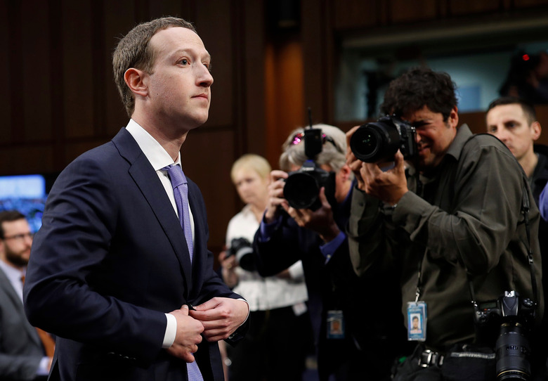 Facebook CEO Mark Zuckerberg stands during a break in testimony before a Senate Judiciary and Commerce Committees joint hearing regarding the company’s use and protection of user data on Capitol Hill in Washington, U.S., April 10, 2018. REUTERS/Aaron P. Bernstein