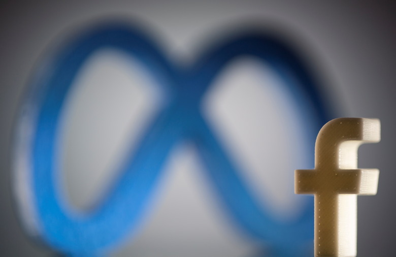 A 3D printed Facebook's new rebrand logo Meta and Facebook logo are seen in this illustration taken on November 2, 2021. REUTERS/Dado Ruvic/Illustration