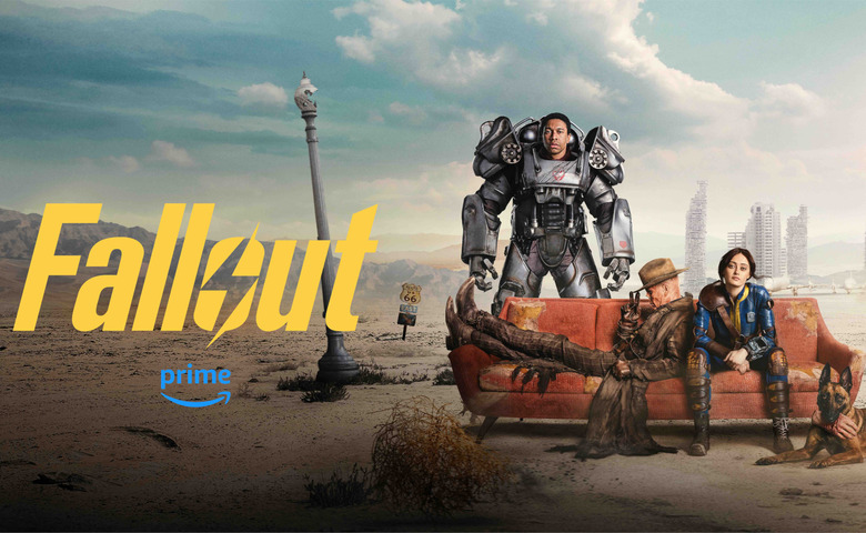 Three people in futuristic clothes and a dilapidated couch.