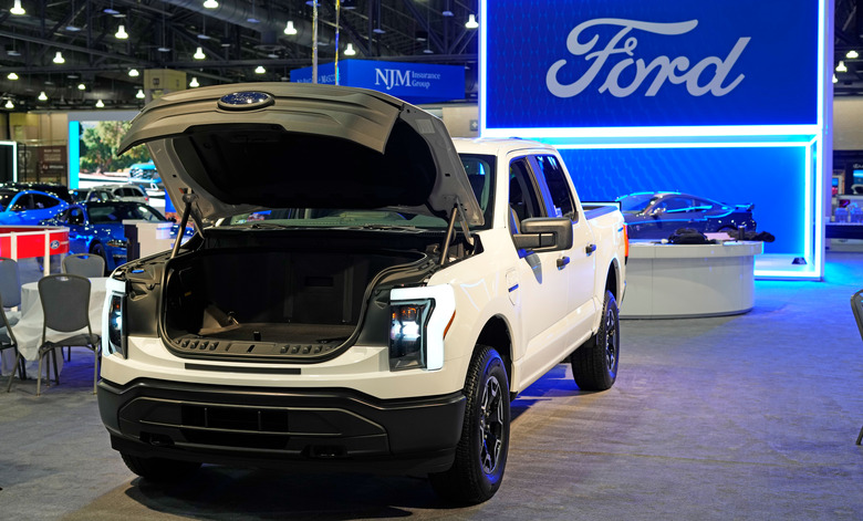 FILE - The Ford F-150 Lightning displayed at the Philadelphia Auto Show on Jan. 27, 2023, in Philadelphia. Ford says it’s reducing production of the F-150 Lightning electric pickup vehicle as it adjusts to weaker-than-expected electric vehicle sales growth.