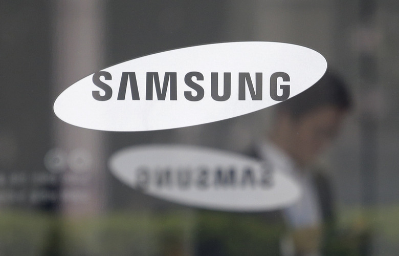 FILE - The logo of the Samsung Electronics Co. is seen at its office in Seoul, South Korea on April 30, 2019. Samsung Electronics said Wednesday, March 15, 2023, it expects to invest 300 trillion won ($230 billion) over the next 20 years as part of an ambitious South Korean national project to build the world’s largest semiconductor manufacturing base near the capital, Seoul. (AP Photo/Ahn Young-joon, File)