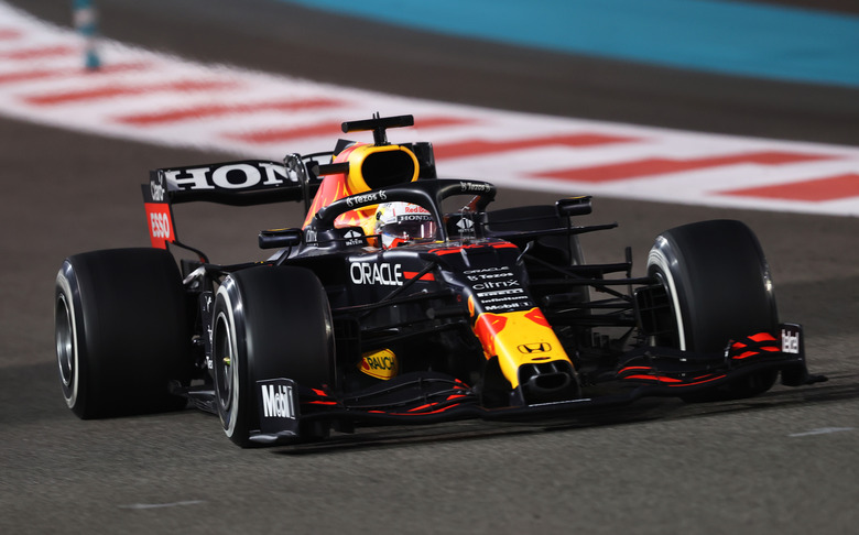 ABU DHABI, UNITED ARAB EMIRATES - DECEMBER 12: Max Verstappen of the Netherlands driving the (33) Red Bull Racing RB16B Honda during the F1 Grand Prix of Abu Dhabi at Yas Marina Circuit on December 12, 2021 in Abu Dhabi, United Arab Emirates. (Photo by Lars Baron/Getty Images)