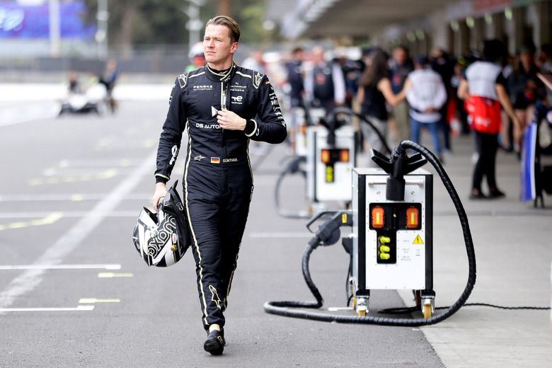 DS Penske's Maximilian Gunther walks down the pit lane lined with Pit Boost chargers during practice at the Mexico E-Prix in January.