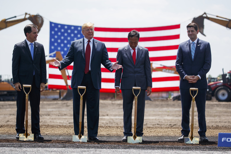 President Donald Trump participates in a Foxconn groundbreaking ceremony, Thursday, June 28, 2018, in Mt. Pleasant, Wis. From left, Gov. Scott Walker, R-Wis., Trump, Foxconn Chairman Terry Gou, and Speaker of the House Rep. Paul Ryan, R-Wis. (AP Photo/Evan Vucci)