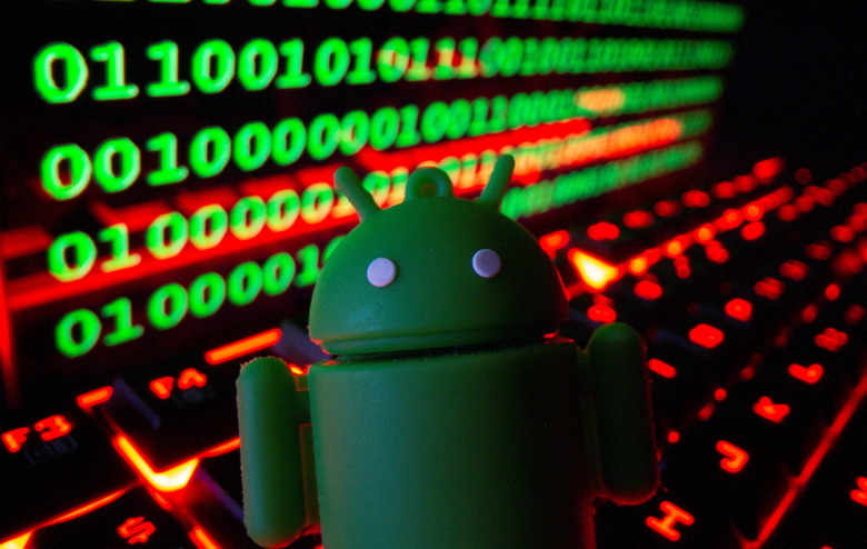 A 3D printed Android logo is pictured on a keyboard in front of binary code in this illustration taken September 24, 2021. REUTERS/Dado Ruvic/Illustration