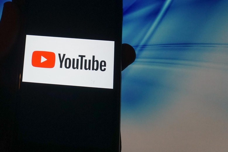 In this photo illustration a Youtube   logo is seen displayed on a smartphone in London 14 November 2020. (Photo illustration by Giannis Alexopoulos/NurPhoto via Getty Images)