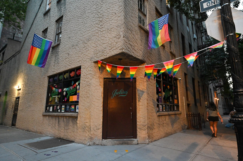 NEW YORK, NEW YORK - JUNE 22: Pride flags hang outside Julius' in the West Village on June 22, 2020 in New York City. Pride Week in New York City usually brings an influx in business to gay and lesbian bars throughout the city. This year due to the ongoing coronavirus pandemic, most Pride events have been canceled and bars remain closed in accordance with city restrictions. Last year's Pride parade drew an estimated four million people. (Photo by Dia Dipasupil/Getty Images)