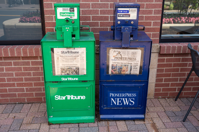Maple Grove, Minnesota - July 21, 2019: Newspaper vending machine kiosks for the StarTribune and St Paul Pioneer Press, the two major daily papers in Twin Cities area