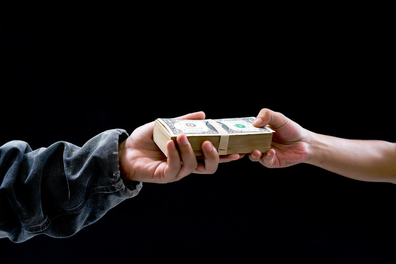 Sending money from one hand to another. Some pay money for trading,buy something , exchanging or sending fraudulent money, corruption.