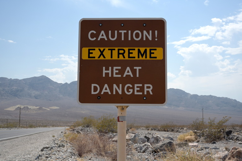A sign warns of extreme heat in Death Valley, California, U.S., July 11, 2021. REUTERS/Bridget Bennett