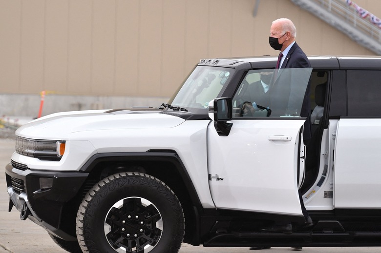 US President Joe Biden test drives a GMC Hummer EV as he tours the General Motors Factory ZERO electric vehicle assembly plant in Detroit, Michigan on November 17, 2021. (Photo by MANDEL NGAN / AFP) (Photo by MANDEL NGAN/AFP via Getty Images)