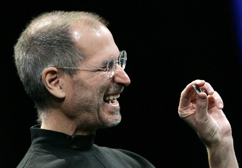 Apple CEO Steve Jobs shows the new Intel 