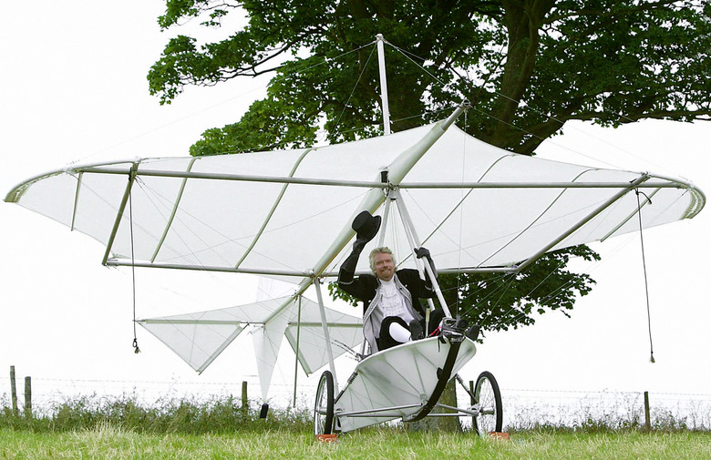 Sir Richard Branson in a replica of Cayley's monoplane glider on the 150th anniversary of the worlds first manned-fight, at Brompton Dale, near Scarborough.   (Photo by Martin Rickett - PA Images/PA Images via Getty Images)