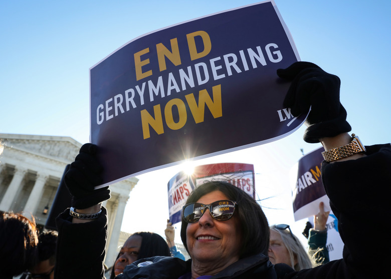 Demonstrators protest during a Fair Maps rally outside the U.S. Supreme Court, in Washington, U.S., March 26, 2019.  REUTERS/Brendan McDermid