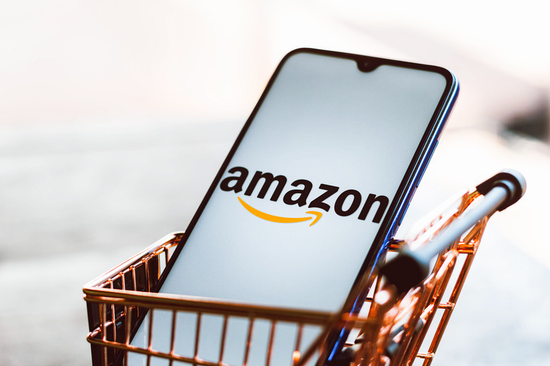 BRAZIL - 2021/09/01: In this photo illustration, an Amazon logo seen displayed on a smartphone along with a shopping cart. (Photo Illustration by Rafael Henrique/SOPA Images/LightRocket via Getty Images)