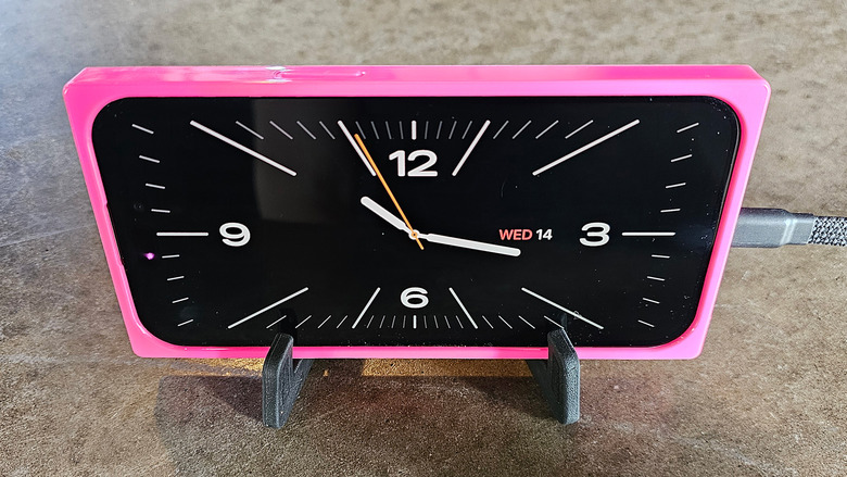 Putting your phone on a stand and plugging it in enables StandBy mode and makes it look like a real alarm clock!