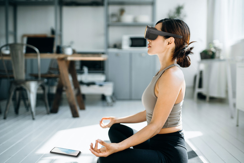 Promotional image of the HTC Flow being used for meditation.