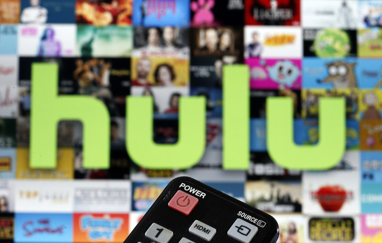 PARIS, FRANCE - MARCH 28: In this photo illustration, a remote control is seen in front of a television screen showing a Hulu logo on March 28, 2020 in Paris, France. As the Coronavirus moves to the U.S., Disney has announced that it will provide a free 24/7 ABC news feed to Hulu Live to On-Demand subscribers. (Photo Illustration by Chesnot/Getty Images)